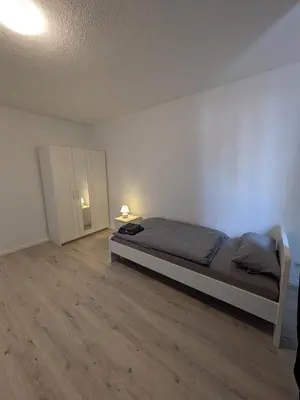 Ein Bett oder Betten in einem Zimmer der Unterkunft interaktiv Appartements in Heiligenhaus - Herzogstrasse