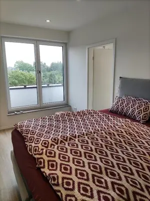 Ein Bett oder Betten in einem Zimmer der Unterkunft Luxuriöse, große Wohnung mit Parkblick