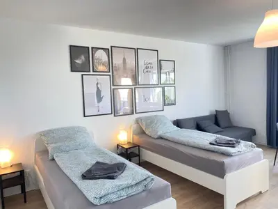 Ein Bett oder Betten in einem Zimmer der Unterkunft Cozy Apartment in Wuppertal