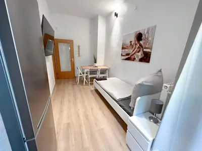 Ein Bett oder Betten in einem Zimmer der Unterkunft Apartment mit großer Küche, 4 Personen
