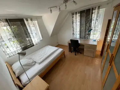 Ein Bett oder Betten in einem Zimmer der Unterkunft Großzügige Ferienwohnung für bis zu 4 Personen mit Balkon