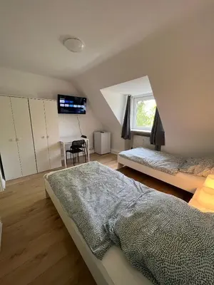 Ein Bett oder Betten in einem Zimmer der Unterkunft RENT SOLUTION - Apartments in Herne - bis zu 10 Personen