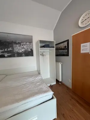 Ein Bett oder Betten in einem Zimmer der Unterkunft Privatunterkunft Am Aaper Wald