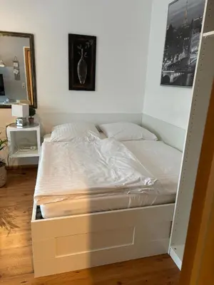 Ein Bett oder Betten in einem Zimmer der Unterkunft Privatunterkunft Am Aaper Wald