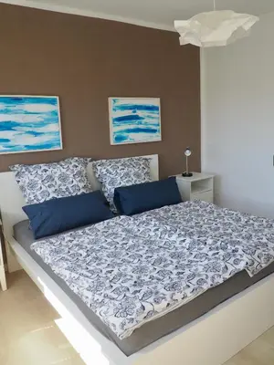 Ein Bett oder Betten in einem Zimmer der Unterkunft Gemütliche Wohnung mit Balkon, verkehrsgünstig gelegen