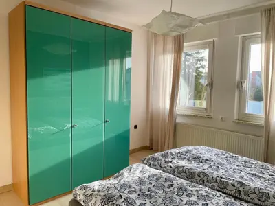 Ein Bett oder Betten in einem Zimmer der Unterkunft Gemütliche Wohnung mit Balkon, verkehrsgünstig gelegen