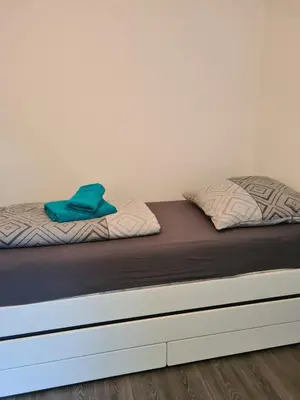 Ein Bett oder Betten in einem Zimmer der Unterkunft Wohnung Haldenblick für max 9 Personen