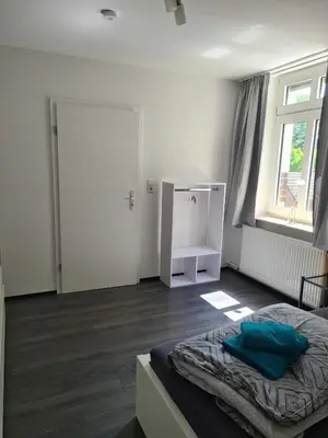 Ein Bett oder Betten in einem Zimmer der Unterkunft Wohnung Haldenblick für max 9 Personen