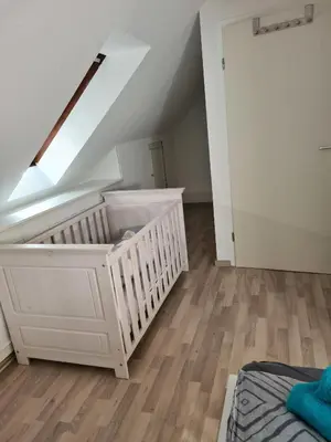 Ein Bett oder Betten in einem Zimmer der Unterkunft Wohnung Haldenblick für max 9 Personen
