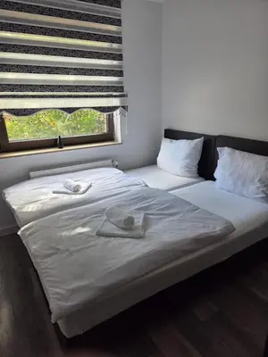 Ein Bett oder Betten in einem Zimmer der Unterkunft Jakz Hotel