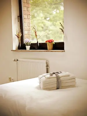 Ein Bett oder Betten in einem Zimmer der Unterkunft Jakz Hotel