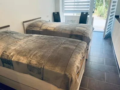 Ein Bett oder Betten in einem Zimmer der Unterkunft Waldstadt Homes, Iserlohn