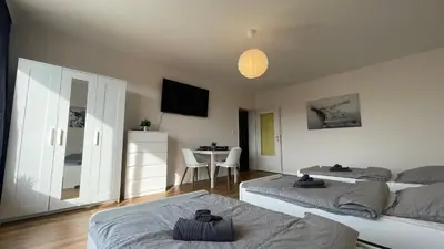 Ein Bett oder Betten in einem Zimmer der Unterkunft GNA01 - Große Wohnung mit 7 Betten, große Küche, 2 Balkone & Parkplatz