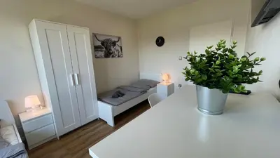 Ein Bett oder Betten in einem Zimmer der Unterkunft GNA01 - Große Wohnung mit 7 Betten, große Küche, 2 Balkone & Parkplatz