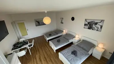 Ein Bett oder Betten in einem Zimmer der Unterkunft GNA01 - Große Wohnung mit 7 Betten, große Küche, 2 Balkone & Parkplatz