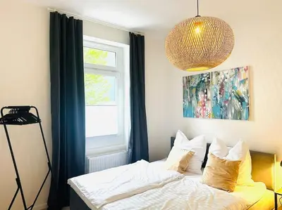 Ein Bett oder Betten in einem Zimmer der Unterkunft WohnTRAUM 140qm - 10 Personen - City - Nähe DUS & Dortmund & Köln & Essen