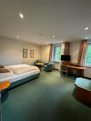 Ein Bett oder Betten in einem Zimmer der Unterkunft Hotel Zur Mühle