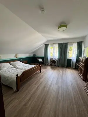 Ein Bett oder Betten in einem Zimmer der Unterkunft Hotel Zur Mühle