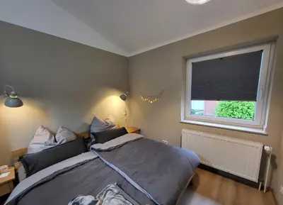 Ein Bett oder Betten in einem Zimmer der Unterkunft Ferienwohnung am Rathenauplatz
