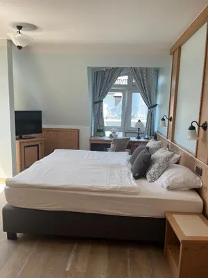 Ein Bett oder Betten in einem Zimmer der Unterkunft Hotel Albers