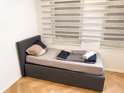 Ein Bett oder Betten in einem Zimmer der Unterkunft Ruhr Business Apartments Essen Apartment mit 5 Einzelbetten Privat Parkplatz