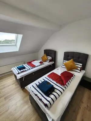 Ein Bett oder Betten in einem Zimmer der Unterkunft City Apart