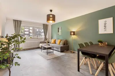 Ein Sitzbereich in der Unterkunft Arena trifft Suite by Cordis Sky in direkter Umgebung zur Arena