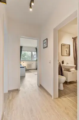 Ein Bett oder Betten in einem Zimmer der Unterkunft Arena trifft Domizil by CordisSky in direkter Umgebung zur Arena