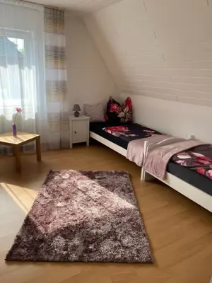 Ein Bett oder Betten in einem Zimmer der Unterkunft Ferienwohnung Steinhoff