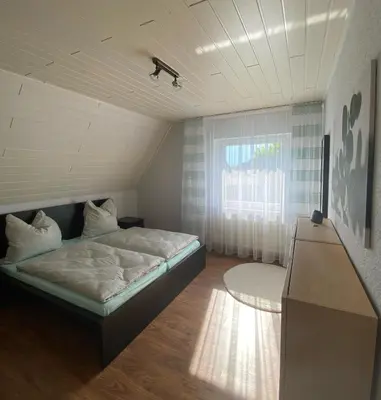 Ein Bett oder Betten in einem Zimmer der Unterkunft Ferienwohnung Steinhoff