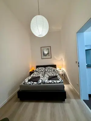 Ein Bett oder Betten in einem Zimmer der Unterkunft Wu Flats