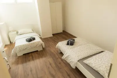 Ein Bett oder Betten in einem Zimmer der Unterkunft Dohann1 Zentrum, Messehalle, Stationnah & Privatparkplatz