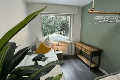 Ein Bett oder Betten in einem Zimmer der Unterkunft Geräumiges Apartment mit XXL Leinwand I Parkplatz I WiFi