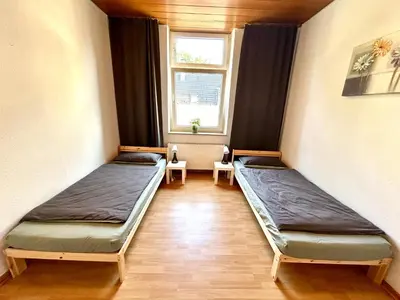 Ein Bett oder Betten in einem Zimmer der Unterkunft Glücksmensch Oberhausen