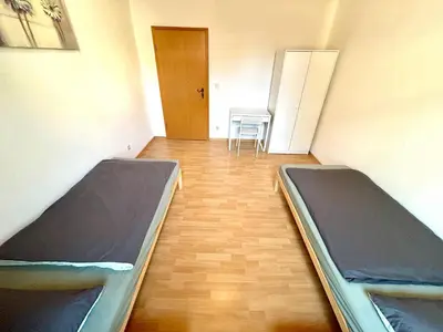 Ein Bett oder Betten in einem Zimmer der Unterkunft Glücksmensch Oberhausen