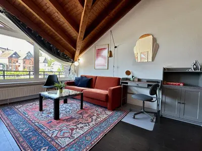 Ein Sitzbereich in der Unterkunft Orange Zebra Suite 4P mit Tiefgarage