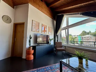 TV/Unterhaltungsangebot in der Unterkunft Orange Zebra Suite 4P mit Tiefgarage