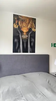 Ein Bett oder Betten in einem Zimmer der Unterkunft LeoMi Ferienwohnung