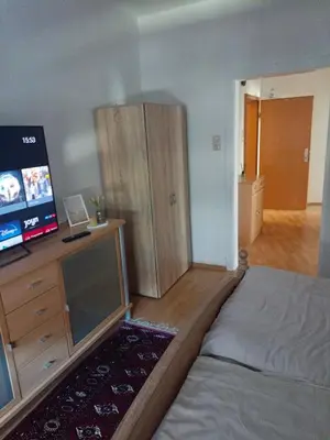 Ein Bett oder Betten in einem Zimmer der Unterkunft Nette Kuschelige Terrassen Wohnung