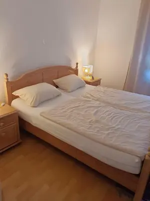 Ein Bett oder Betten in einem Zimmer der Unterkunft Nette Kuschelige Terrassen Wohnung