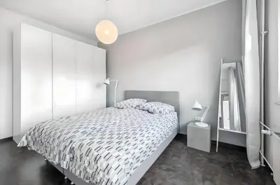 Ein Bett oder Betten in einem Zimmer der Unterkunft Rü-Juwel Design-Apartment - Messe, Gruga, Kruppklinik, Prime