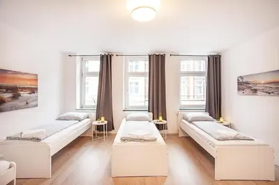 Ein Bett oder Betten in einem Zimmer der Unterkunft Duisburg Studio by TM