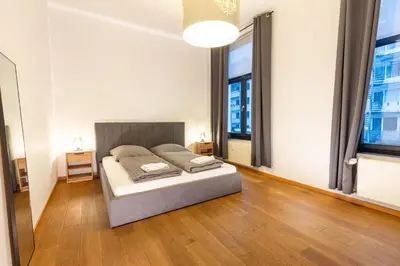 Ein Bett oder Betten in einem Zimmer der Unterkunft Pempelfort Luxury Townhouse