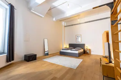 Ein Bett oder Betten in einem Zimmer der Unterkunft Pempelfort Luxury Townhouse