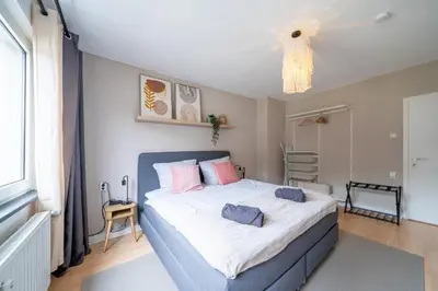 Ein Bett oder Betten in einem Zimmer der Unterkunft Boho Bliss 2R Apartment Zentral