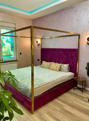 Ein Bett oder Betten in einem Zimmer der Unterkunft Aura Apartment und Spa Oberhausen