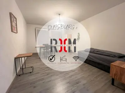 Ein Sitzbereich in der Unterkunft Livemore24 - Apartment 5 in Duisburg WLAN - Smart-TV - 24-7 Check-in und Küche