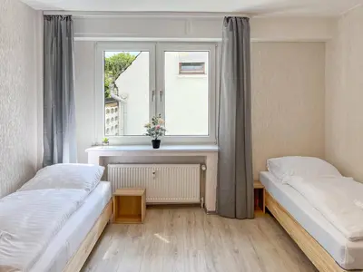 Ein Bett oder Betten in einem Zimmer der Unterkunft T&K Apartments near Messe Fair Trade Düsseldorf und Airport EG