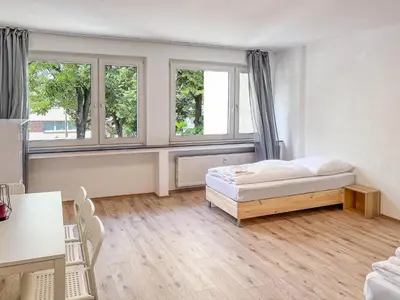 Ein Bett oder Betten in einem Zimmer der Unterkunft T&K Apartments near Messe Fair Trade Düsseldorf und Airport 1A