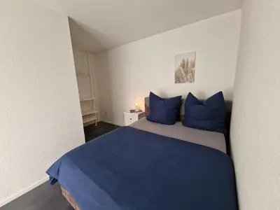 Ein Bett oder Betten in einem Zimmer der Unterkunft Moers City Apartments OG